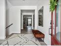 Bright and spacious entryway with a bench and large artwork at 11053 Bright Sky Cir, Littleton, CO 80125