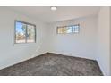 Spacious bedroom with neutral carpeting and ample natural light at 2030 Nome St, Aurora, CO 80010