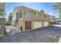 Building exterior showcasing multiple units with attached garages and a private entrance at 7902 Meade St # C10, Westminster, CO 80030
