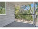 Private balcony offering a view of lush greenery and mature trees at 7902 Meade St # C10, Westminster, CO 80030