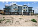 Modern townhome community with multiple units and balconies at 6940 Merseyside Ln, Castle Pines, CO 80108