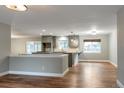 Open kitchen with modern cabinets and hardwood floors at 2515 S Pagosa St, Aurora, CO 80013