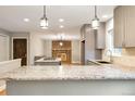 Modern kitchen featuring granite countertops and a brick fireplace at 2515 S Pagosa St, Aurora, CO 80013