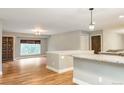 Bright living room with hardwood floors and updated kitchen island at 2515 S Pagosa St, Aurora, CO 80013
