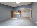 Open living room with kitchen, dining and access to balcony at 3462 S Eagle St # 201, Aurora, CO 80014