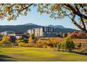 Building nestled in scenic landscape, offering views of mountains and park at 12983 W Ida Ave # 320, Littleton, CO 80127