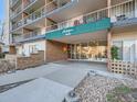 Front entrance of the building, featuring a sign and landscaping at 4800 Hale Pkwy # 206N, Denver, CO 80220