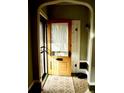 Inviting entryway with a vintage wood door and tiled flooring at 1428 S Grant St, Denver, CO 80210