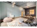 Open living area with exposed beams, modern furniture, and a cozy atmosphere at 910 Santa Fe Dr # 19, Denver, CO 80204