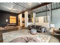 Spacious living room features an open floor plan with kitchen and gym views at 910 Santa Fe Dr # 19, Denver, CO 80204