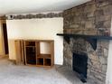 Stone fireplace in living room at 13261 E Asbury Dr # 202, Aurora, CO 80014