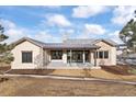 Ranch style home with large backyard and covered patio at 8015 Parnassus Pl, Castle Rock, CO 80108