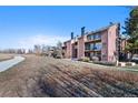 Building exterior showcasing a pathway and landscaping at 4899 S Dudley St # 7H, Littleton, CO 80123
