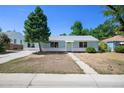 Light blue house with a well-maintained lawn at 731 Hanover St, Aurora, CO 80010