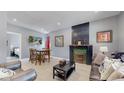 Living room with fireplace, dining area, and view of bedroom at 638 S Lincoln St, Denver, CO 80209