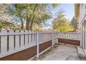 Small patio area with wooden fence and gate at 14543 E 12Th Ave, Aurora, CO 80011