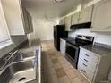 Kitchen boasting granite countertops and stainless steel appliances at 12154 E Virginia Dr, Aurora, CO 80012