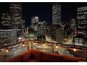 Night city view from a condo balcony with string lights and seating at 2001 Lincoln St # 1910, Denver, CO 80202