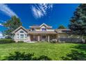 Two-story house with brick and siding exterior at 8777 Selly Rd, Parker, CO 80134