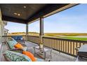 Relaxing covered patio overlooking a scenic golf course at 3010 Newfound Lake Rd, Berthoud, CO 80513