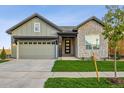 Modern two-story home with stone accents and a two-car garage at 3010 Newfound Lake Rd, Berthoud, CO 80513