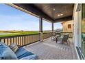 Spacious covered patio with golf course views and outdoor grill at 3010 Newfound Lake Rd, Berthoud, CO 80513