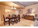 Elegant dining room with hardwood floors and a chandelier at 275 S Harrison St # 305, Denver, CO 80209