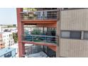 Two-level condo balcony with outdoor furniture and city views at 100 Park W Ave # 608, Denver, CO 80205