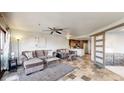 Open concept living area with tile floors and a cozy seating arrangement at 100 Park W Ave # 608, Denver, CO 80205