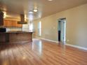 Spacious kitchen with hardwood floors and island at 230 Emery St, Longmont, CO 80501