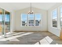 Spacious dining area with large windows offering ample natural light and a view at 694 Penn Rd, Elizabeth, CO 80107