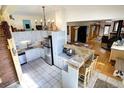 Bright kitchen with light-colored cabinets, stainless steel appliances, and a breakfast bar at 1339 Quince St, Denver, CO 80220