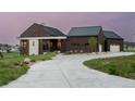 Modern farmhouse with long driveway and attached garage at 11229 Running Kit Pl, Franktown, CO 80116