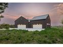 Two-car attached garage with modern design at 11229 Running Kit Pl, Franktown, CO 80116