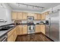 Modern kitchen with stainless steel appliances and dark countertops at 466 Black Feather Loop # 510, Castle Rock, CO 80104