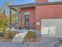 Front entrance with stairs, wreath, and attached garage at 2514 Sweet Wind Ave, Castle Rock, CO 80109