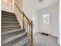 Entryway with staircase, coat closet and carpet flooring at 7993 S Jay Dr, Littleton, CO 80128