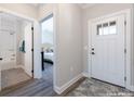 Bright entryway with view of bedroom and bathroom at 303 Josef Cir, Fort Lupton, CO 80621
