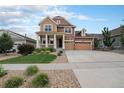 Two-story house with attached garage and front yard at 20052 W 95Th Pl, Arvada, CO 80007
