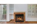 Fireplace with terracotta tile surround in the living room at 13824 E Lehigh Ave # C, Aurora, CO 80014