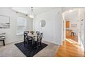 Dining area with table, chairs, and kitchen view at 17048 E Trailmaster Dr, Parker, CO 80134