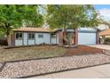 Single story home with landscaped yard at 3754 S Mission Pkwy, Aurora, CO 80013