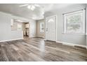 Bright living room featuring wood-look floors and an open floorplan at 46 Winona Ct, Denver, CO 80219