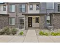Modern townhome exterior with stone accents at 19733 W 93Rd Ln # D, Arvada, CO 80007