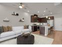 Open concept kitchen and living area with modern appliances at 19733 W 93Rd Ln # D, Arvada, CO 80007