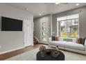 Living Room with large window and view at 19733 W 93Rd Ln # D, Arvada, CO 80007
