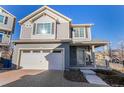 Two-story house with attached garage and landscaped front yard at 237 S Old Hammer St, Aurora, CO 80018