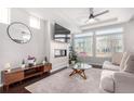 Spacious living room featuring a modern fireplace and large windows at 237 S Old Hammer St, Aurora, CO 80018