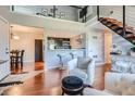 Open living space with a kitchen island, dining area, and loft at 10785 W 63Rd Pl # 307, Arvada, CO 80004