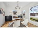 Bright home office with built-in cabinetry and large windows at 2650 Zenobia, Denver, CO 80212